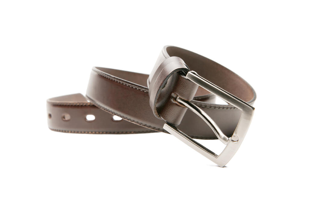 Brown stylish men's belts coiled.